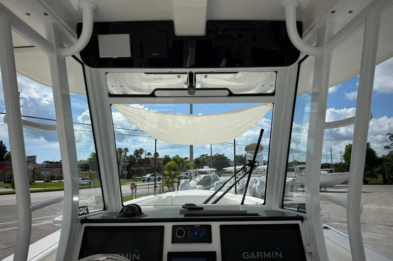 Slide: The Image of Interior view of 2022 Edgewater 340CC boat cockpit with Garmin navigation system. - 26