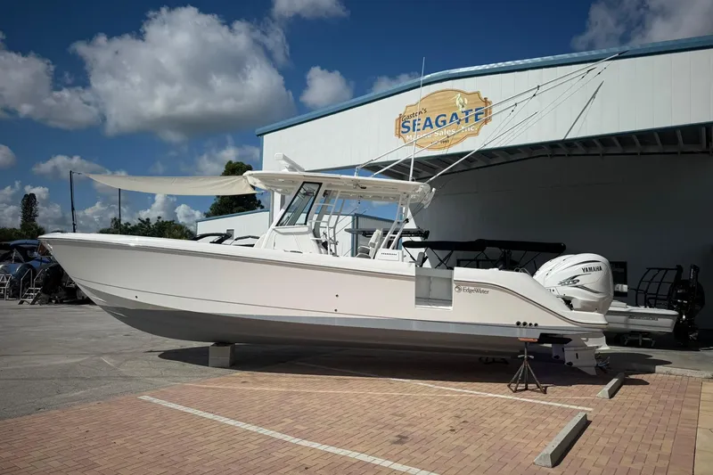 Slide: The Image of 2022 Edgewater 340CC boat displayed at Seagate Marine, featuring Yamaha engines. - 2