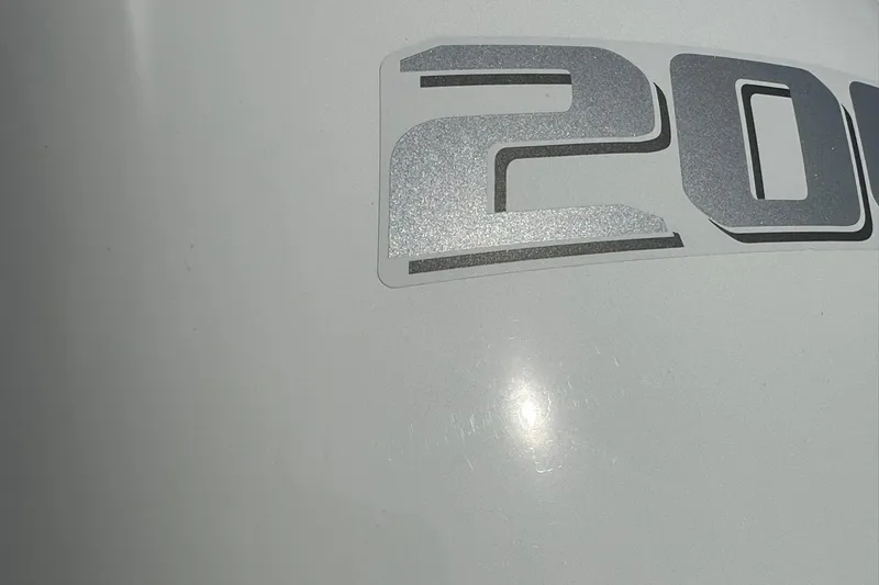 Slide: The Image of Close-up of 2024 NauticStar 211 Hybrid boat model number. - 25