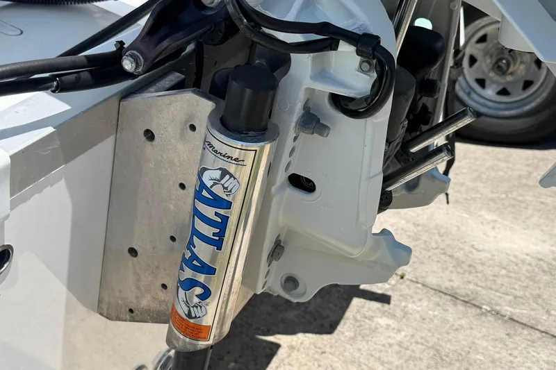 Slide: The Image of Close-up of 2024 NauticStar 211 Hybrid boat's Atlas hydraulic jack plate. - 20