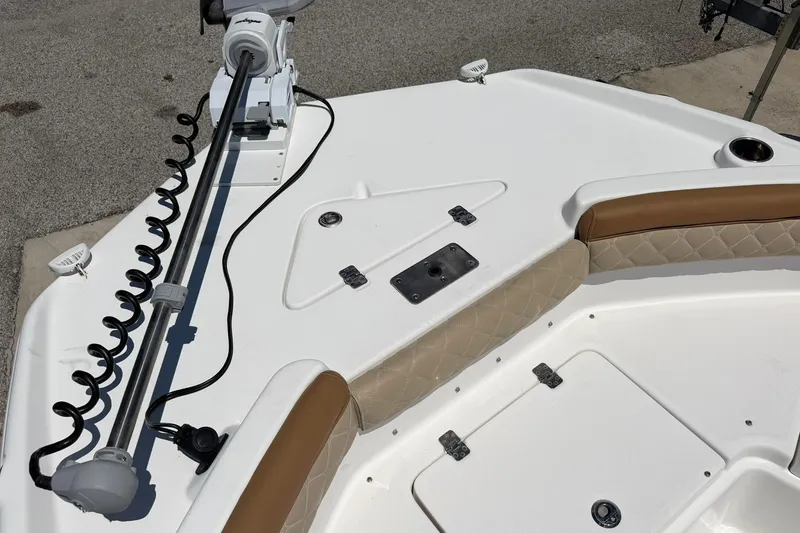 Slide: The Image of 2024 NauticStar 211 Hybrid boat deck with seating and trolling motor. - 3