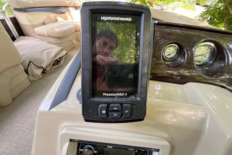 Slide: The Image of Humminbird PiranhaMAX 4 fish finder on 2016 Bennington SX 20 boat dashboard. - 15
