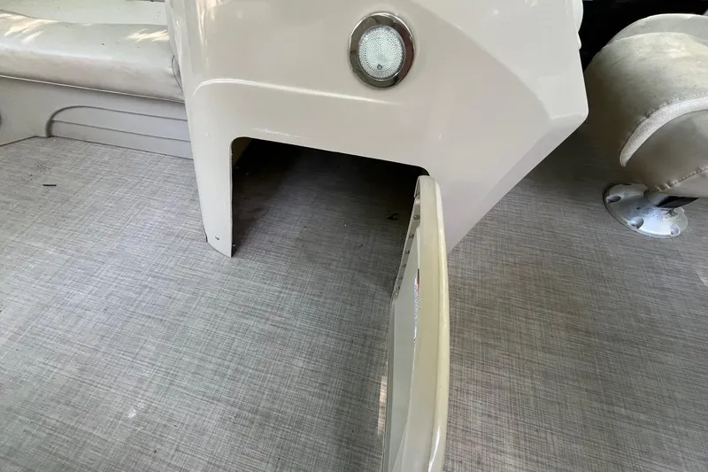 Slide: The Image of Interior of a 2016 Bennington SX 20 boat showing seating and flooring details. - 12