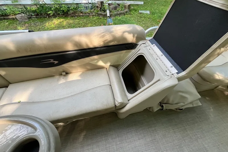 Slide: The Image of 2016 Bennington SX 20 boat seat with open storage compartment, beige upholstery. - 17