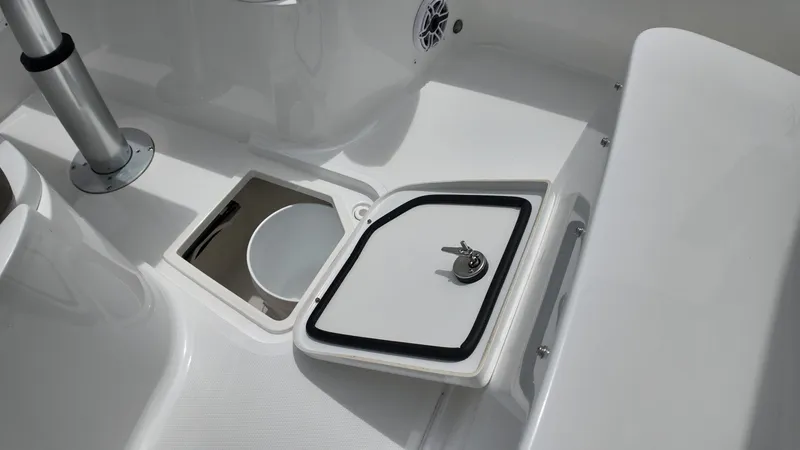 Slide: The Image of Close-up of a Sea Hunt Gamefish 30 deck with storage compartment and seating area. - 37