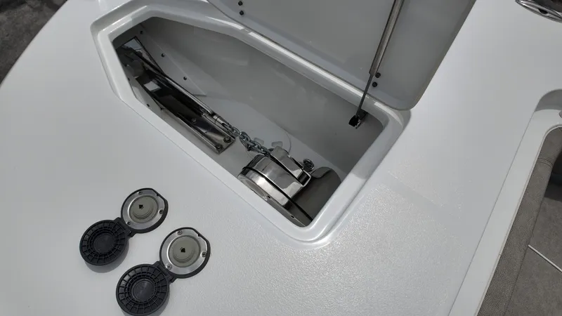 Slide: The Image of An open storage compartment on a boat with two round covers beside it. - 35
