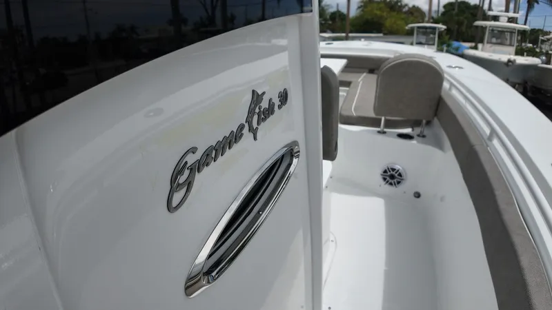 Slide: The Image of Close-up of Sea Hunt Gamefish 30 with gray seating and speaker. - 33