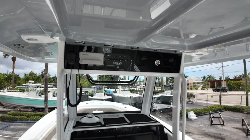 Slide: The Image of The image shows the cockpit of a Sea Hunt Gamefish 30 with modern electronics and controls. - 27
