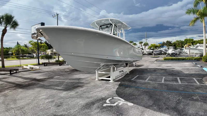 Slide: The Image of Sea Hunt Gamefish 30 Forward Seating 2026 on a parking lot with palm trees in the background. - 7