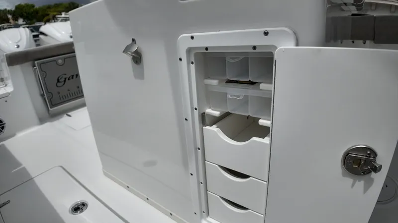Slide: The Image of The image shows a boat's storage area with multiple drawers and compartments. - 43
