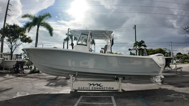 Slide: The Image of Sea Hunt Gamefish 30 Forward Seating, 2026 model, displayed in a parking lot. - 8