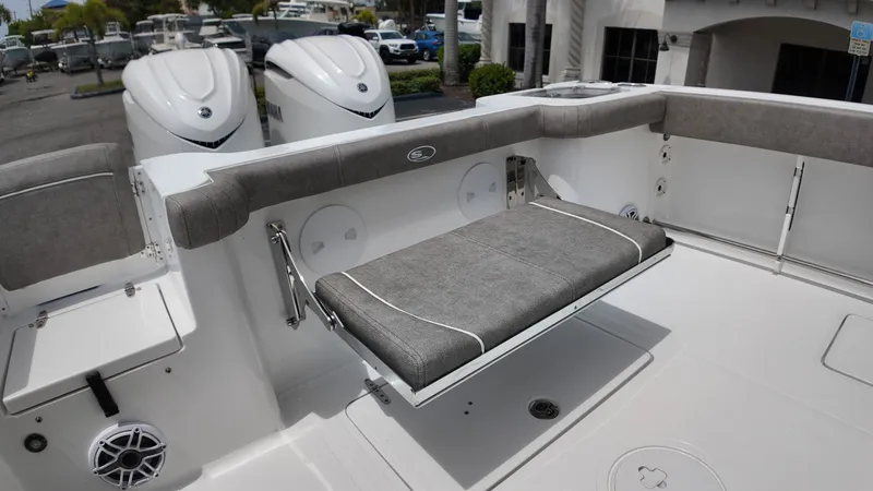 Slide: The Image of The 2026 Sea Hunt Gamefish 30 features a foldable bench seat in the aft area. - 11
