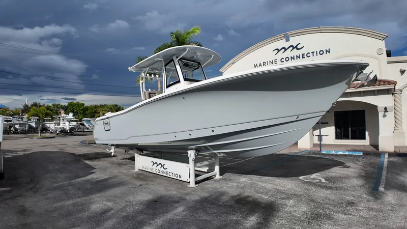 Slide: The Image of Sea Hunt Gamefish 30 with forward seating, year 2026, parked in front of a building. - 5