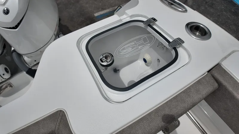 Slide: The Image of Close-up of a boat cooler with logo and gray upholstery. - 14