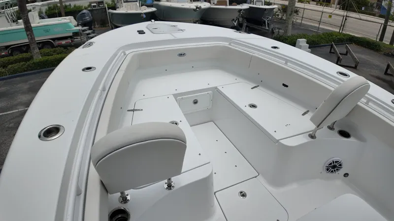 Slide: The Image of The image shows the deck of a 2027 Sea Hunt Ultra 265 SE boat. - 34