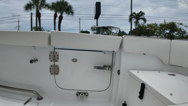 Slide: The Image of The image shows the stern of a boat with white upholstery and stainless steel fittings. - 23
