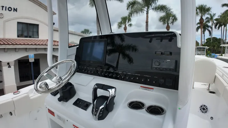 Slide: The Image of Helm of the Sea Hunt Ultra 265 SE with modern steering wheel and electronics. - 26
