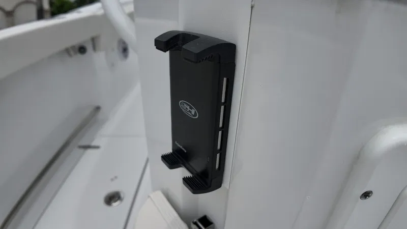 Slide: The Image of Close-up of a black holder on the white boat wall. - 18