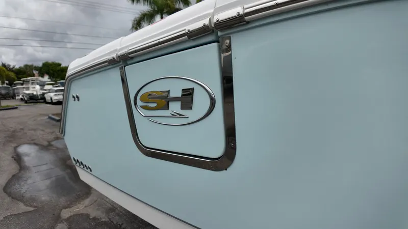 Slide: The Image of Close-up of the 2027 Sea Hunt Ultra 265 SE with logo on the side. - 7