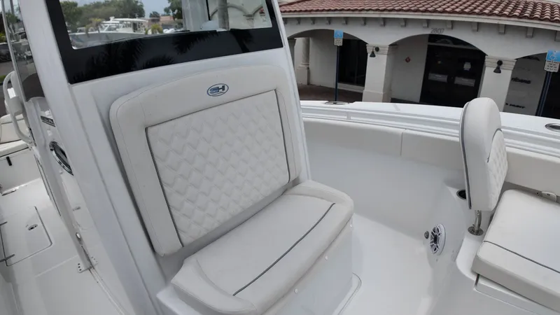 Slide: The Image of The 2027 Sea Hunt Ultra 265 SE features an elegant, cushioned bench seat with a quilted pattern. - 44