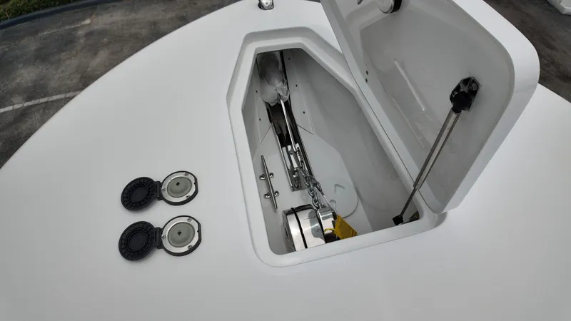 Slide: The Image of Close-up of an anchor locker on a boat, featuring chain and lid. - 36