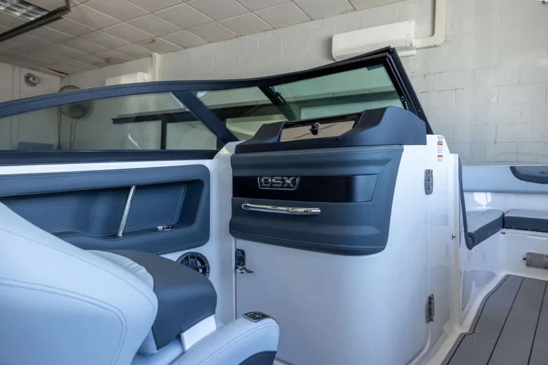 Slide: The Image of Interior view of 2026 Chaparral 250 OSX boat, showcasing sleek design and modern features. - 11