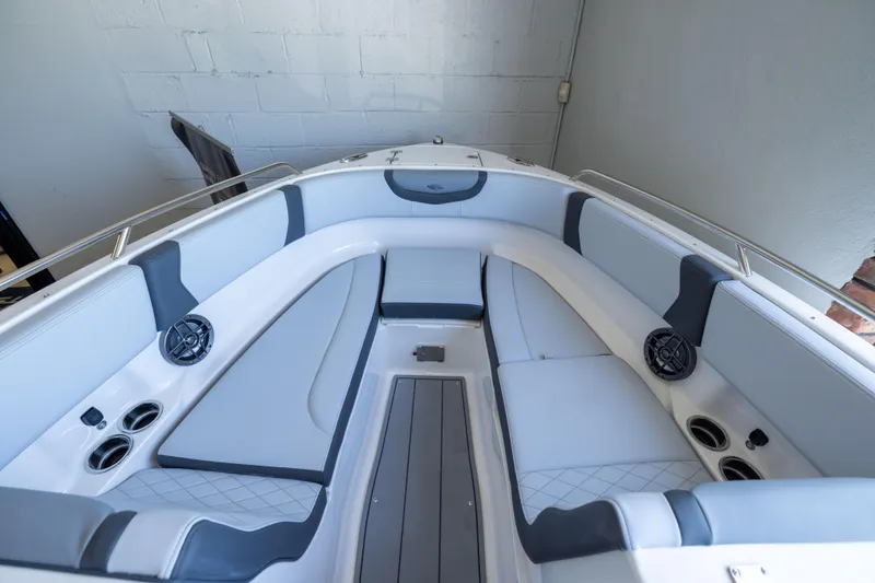 Slide: The Image of 2026 Chaparral 250 OSX boat interior with sleek seating and modern design. - 13