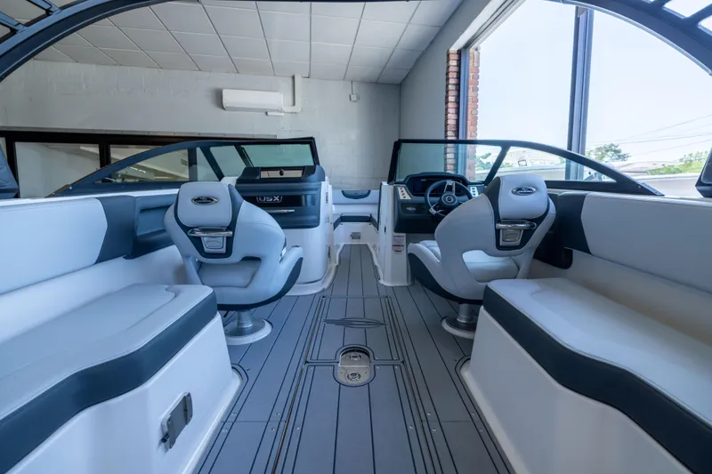 Slide: The Image of Interior of 2026 Chaparral 250 OSX boat, featuring modern seating and sleek design. - 5