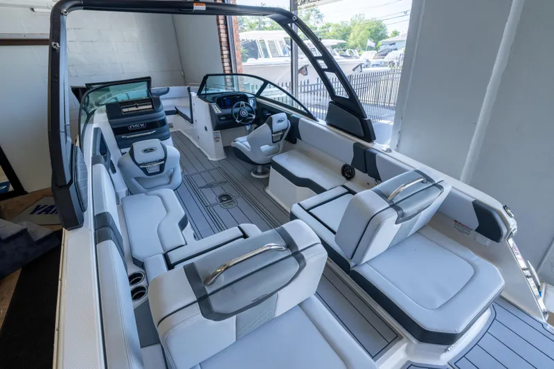 Slide: The Image of 2026 Chaparral 250 OSX boat interior with modern seating and sleek design. - 3