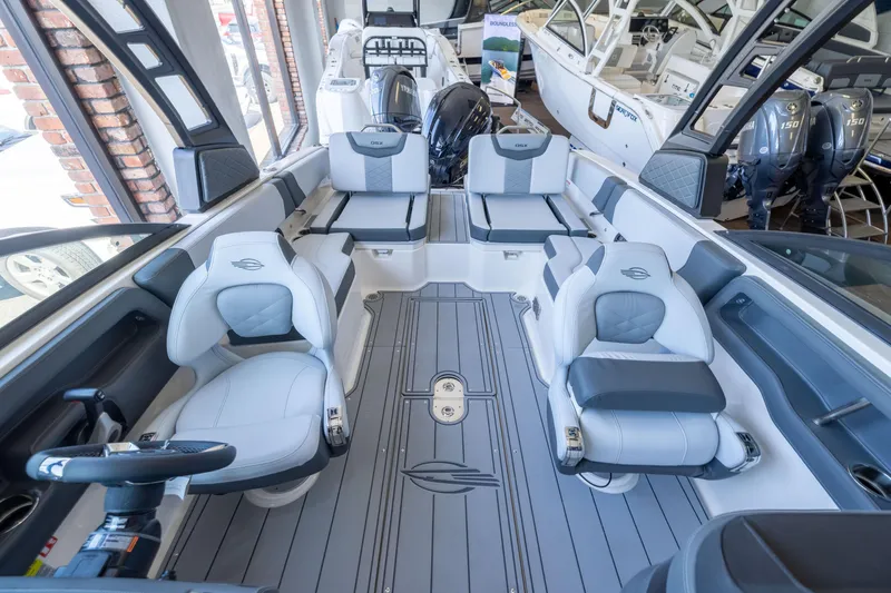 Slide: The Image of 2026 Chaparral 250 OSX boat interior with modern seating and sleek design. - 6