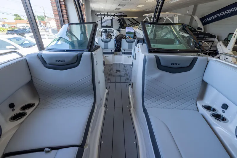 Slide: The Image of 2026 Chaparral 250 OSX boat interior with sleek seating and modern design. - 15