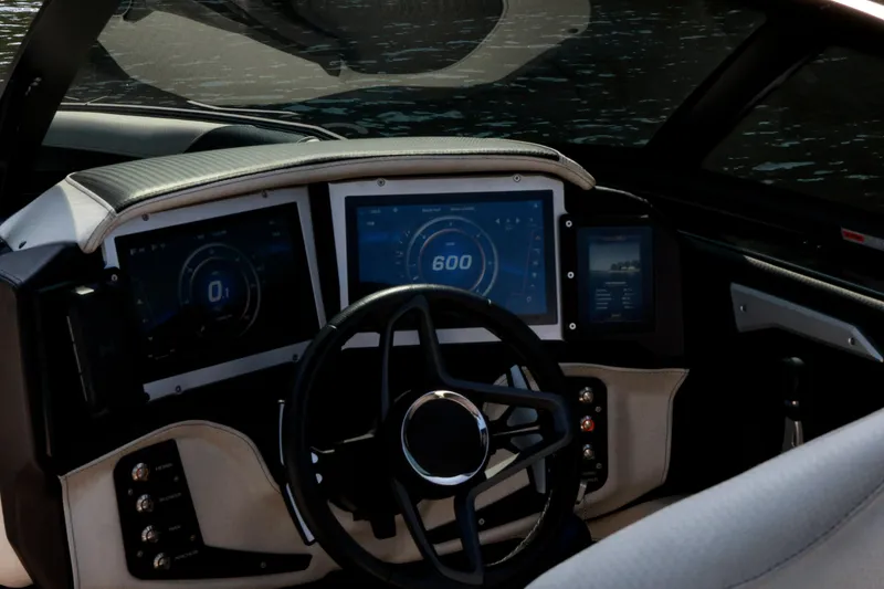Slide: The Image of 2022 Centurion Ri265 dashboard with digital displays and steering wheel. - 16