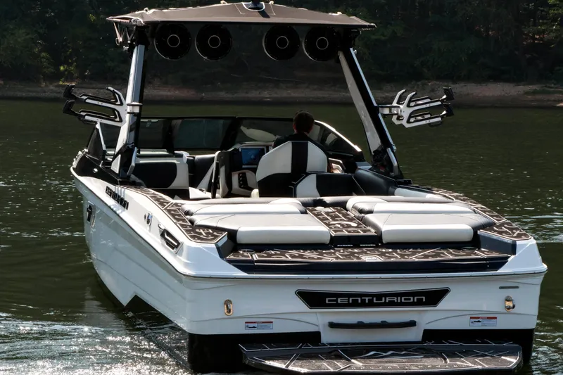 Slide: The Image of 2022 Centurion Ri265 boat on water, featuring sleek design and modern amenities. - 9