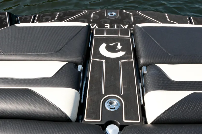 Slide: The Image of 2022 Centurion Ri265 boat interior with sleek black and white seating design. - 13