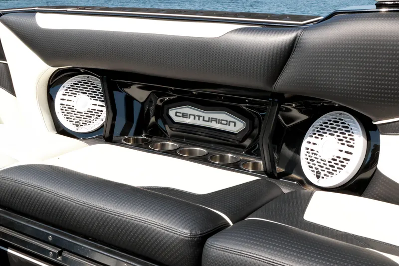 Slide: The Image of 2022 Centurion Ri265 boat interior with speakers and cup holders. - 22