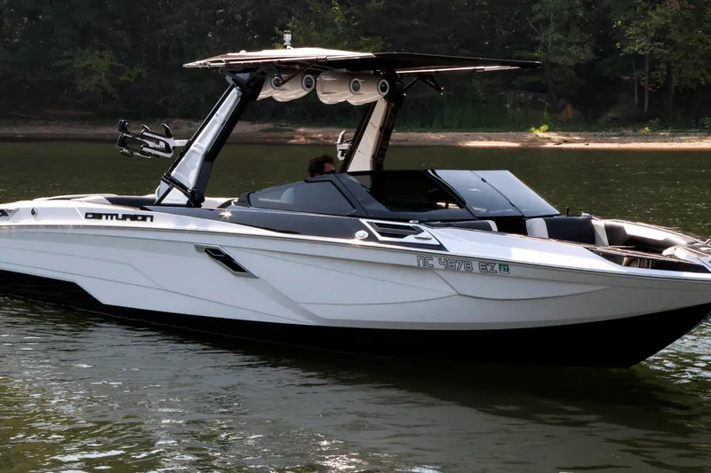 Slide: The Image of 2022 Centurion Ri265 boat on calm water, featuring sleek design and modern amenities. - 2