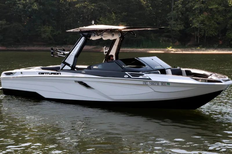 Slide: The Image of 2022 Centurion Ri265 boat on calm water, featuring sleek design and modern amenities. - 3