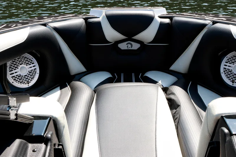 Slide: The Image of Interior of 2022 Centurion Ri265 boat with sleek black and white seating design. - 18