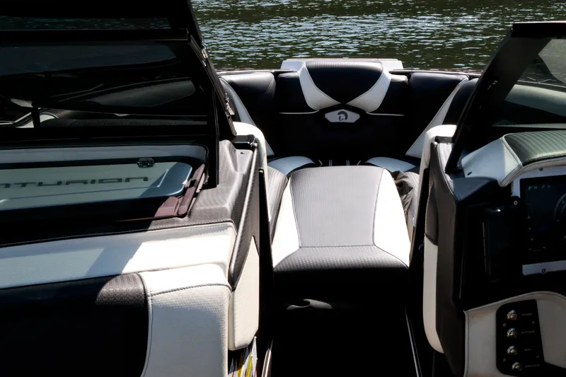 Slide: The Image of Interior view of 2022 Centurion Ri265 boat with sleek seating and dashboard design. - 17