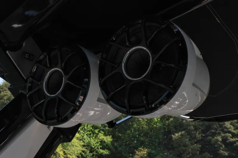 Slide: The Image of 2022 Centurion Ri265 boat speakers, black and white design, mounted under canopy. - 23