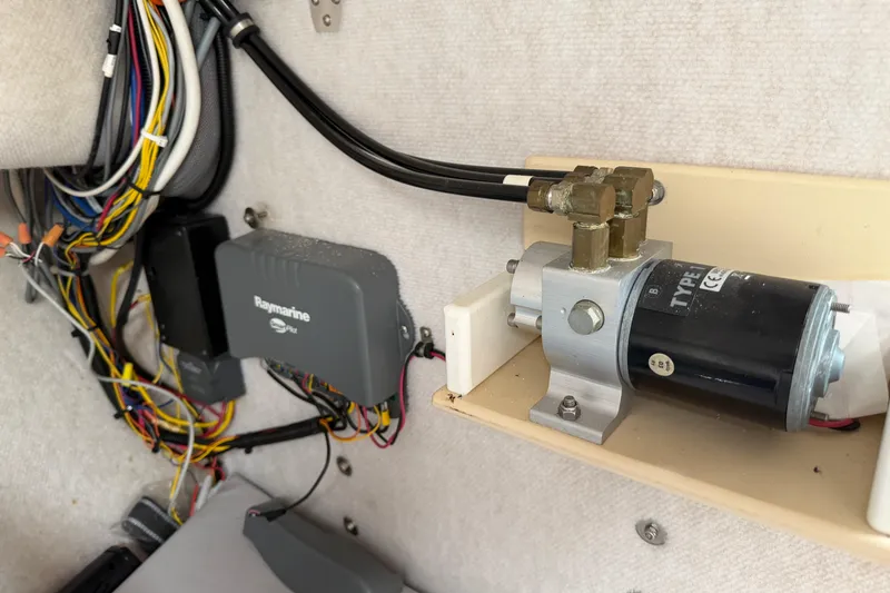 Slide: The Image of Electrical wiring and Raymarine equipment inside a 2004 Osprey Expedition 26 boat. - 10
