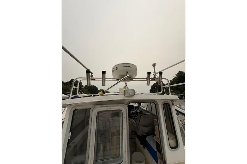 Slide: The Image of 2004 Osprey Expedition 26 boat with radar equipment and cockpit view. - 15