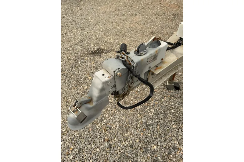 Slide: The Image of Trailer hitch with lock and chain on gravel, Osprey Expedition 26, 2004 model. - 20
