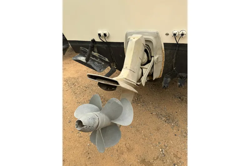 Slide: The Image of Boat propeller and stern of a 2004 Osprey Expedition 26 on sandy ground. - 19
