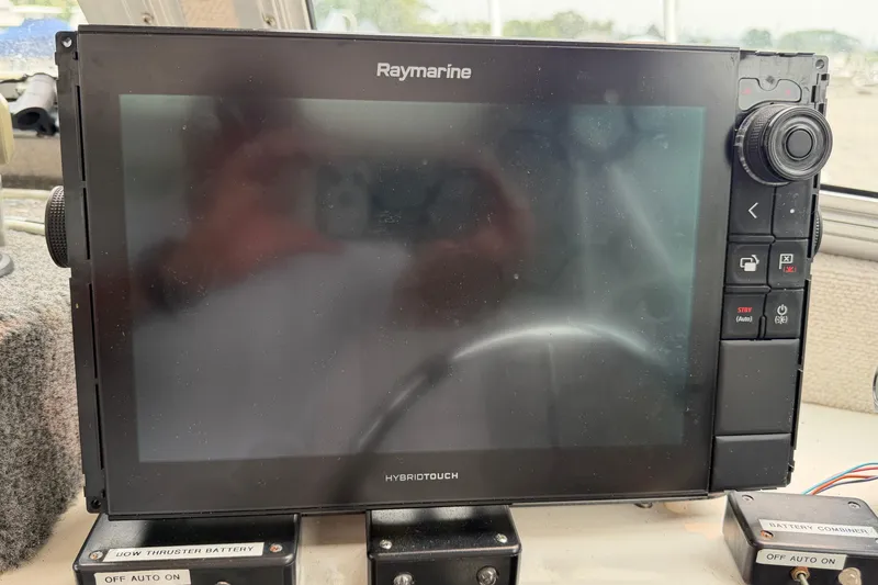 Slide: The Image of Raymarine HybridTouch display on 2004 Osprey Expedition 26 boat dashboard. - 3