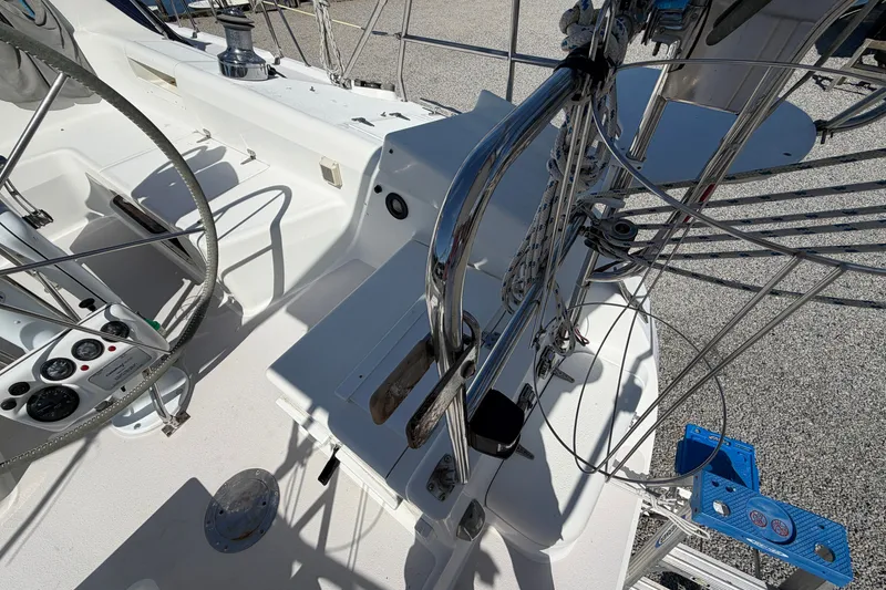 Slide: The Image of Cockpit of a 2003 Catalina 380 sailboat with steering wheel and control panel. - 30