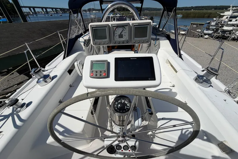 Slide: The Image of Cockpit of a 2003 Catalina 380 sailboat with navigation instruments and steering wheel. - 1