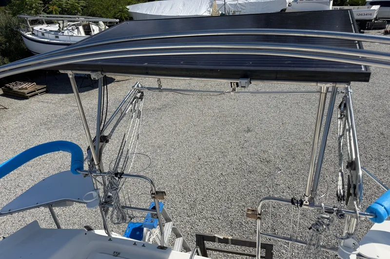Slide: The Image of Catalina 380 sailboat, 2003 model, featuring solar panels and rigging equipment on deck. - 31
