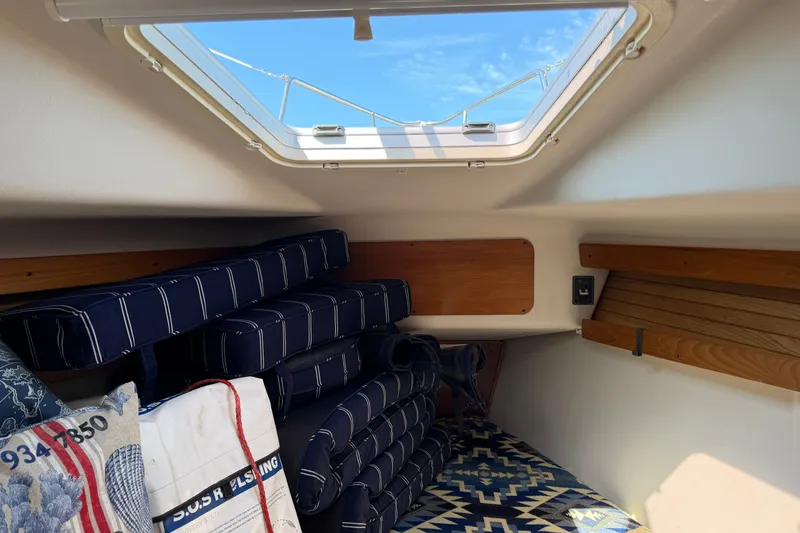 Slide: The Image of Interior cabin of 2003 Catalina 380 sailboat with cushions and skylight. - 22