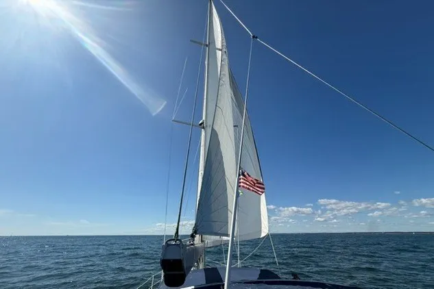 Slide: The Image of Sailing on a 2003 Catalina 380 yacht under clear blue skies. - 33